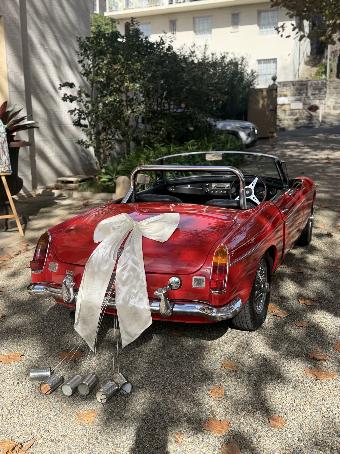Couple with classic MG B roadster on wedding day Sydney